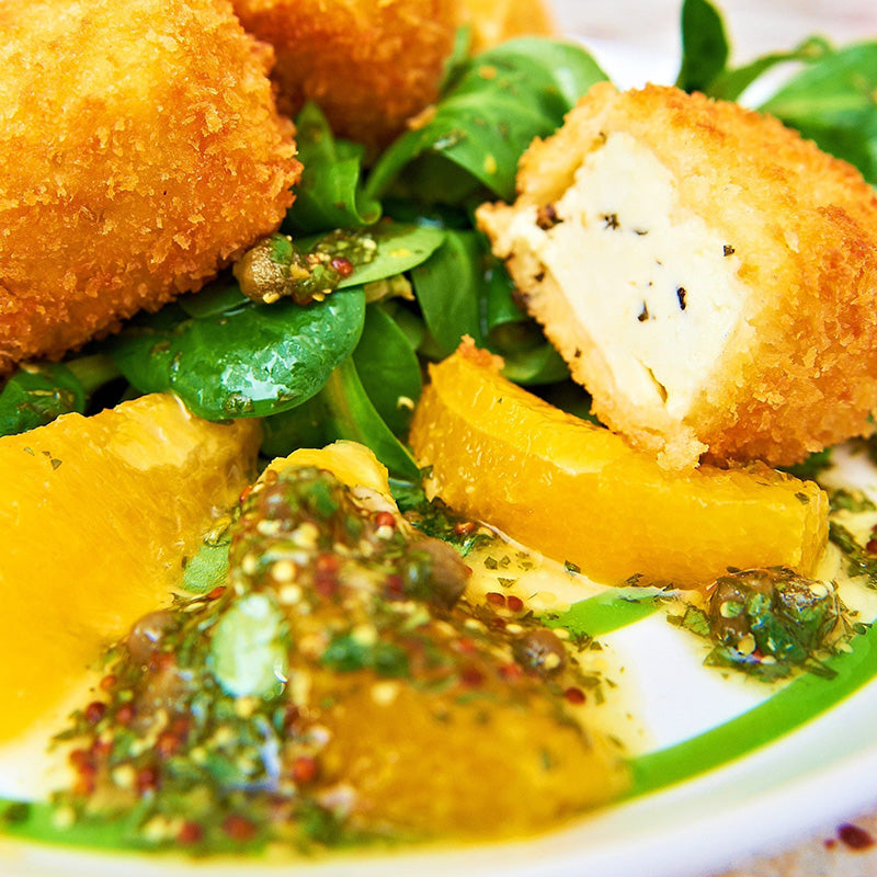 lemon battered halloumi cheese making kit on place with salad dressing