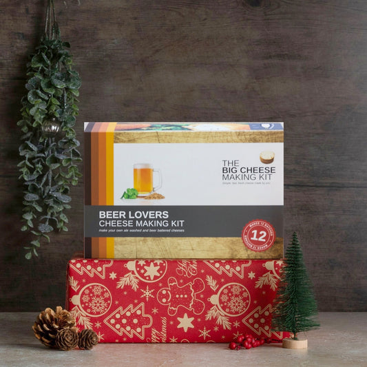 Beer Lover's Cheese Making Kit on a red wrapped Christmas present