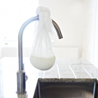 Big Cheese Making Kit Scottish Crowdie cheese making process, cheese draining in cloth bag hanging from faucet.