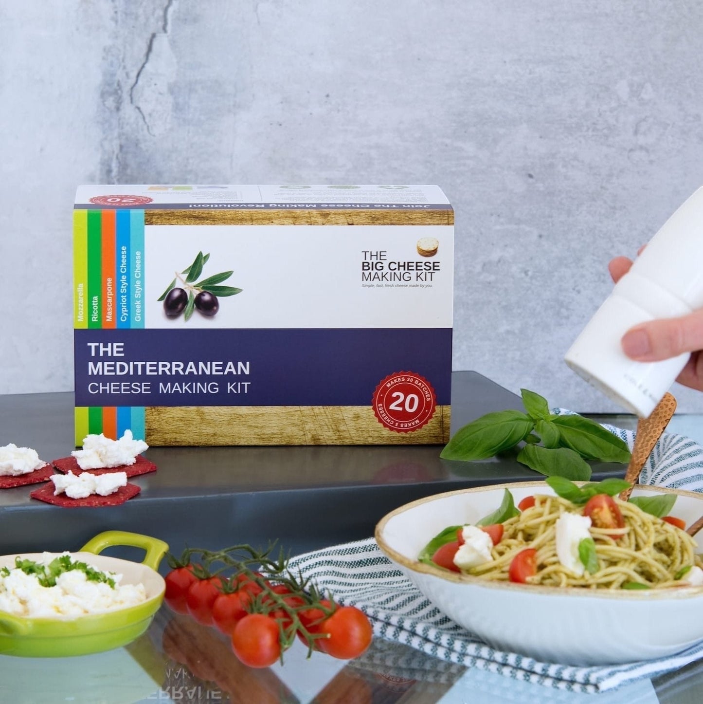 The Big Cheese Making Kit Mediterranean Cheese Making Kit box with ingredients and finished cheese dishes.