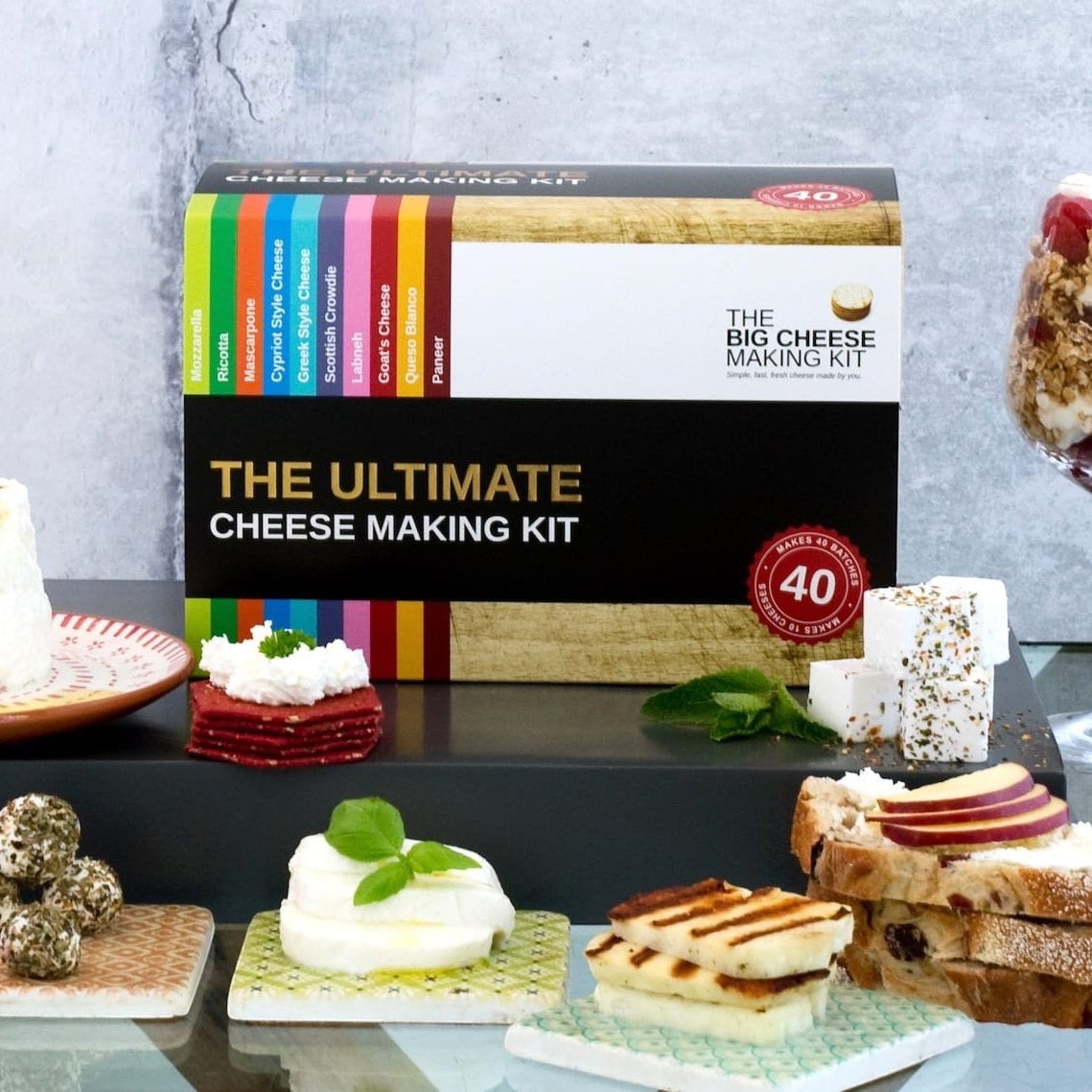 The Big Cheese Making Kit box with 10 cheese varieties listed, includes recipe book, molds, herbs & spices. Makes 40 batches.