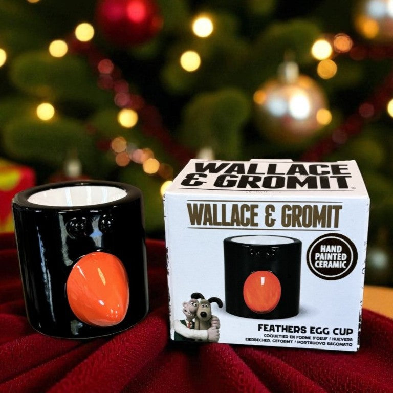 Wallace & Gromit Feathers Egg Cup with packaging against a festive background