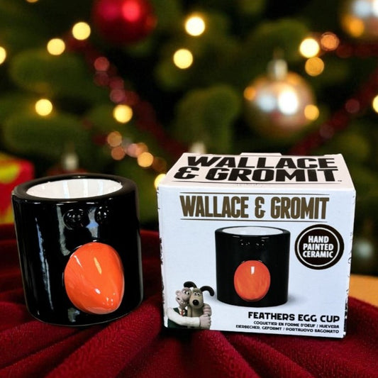 Wallace & Gromit Feathers Egg Cup with packaging against a festive background