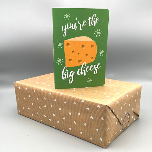 green 'you're the big cheese' gift card on wrapped present