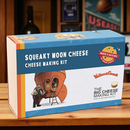 Squeaky Moon Cheese cheese making kit packaging on a wooden surface