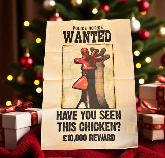 Wanted poster kitchen tea towel gift for a chicken with Christmas decorations in the background