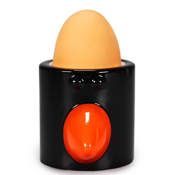 black feathers wallace and gromit egg cup gift with egg inside on isolated white background
